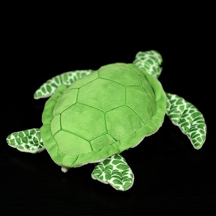 Side profile of the green sea turtle plush, featuring a soft shell and patterned flippers