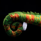 Detailed view of the curled tail on the veiled chameleon plush with realistic color patterns