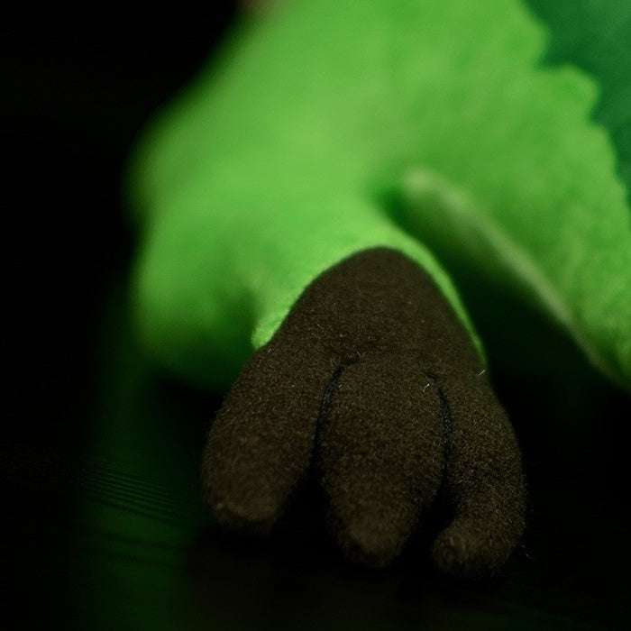 Spinosaurus plush forelimb in dark brown fabric, showcasing realistic claws and soft, durable material