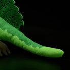 Spinosaurus plush tail featuring a long, smooth green texture with accurate Jurassic detailing