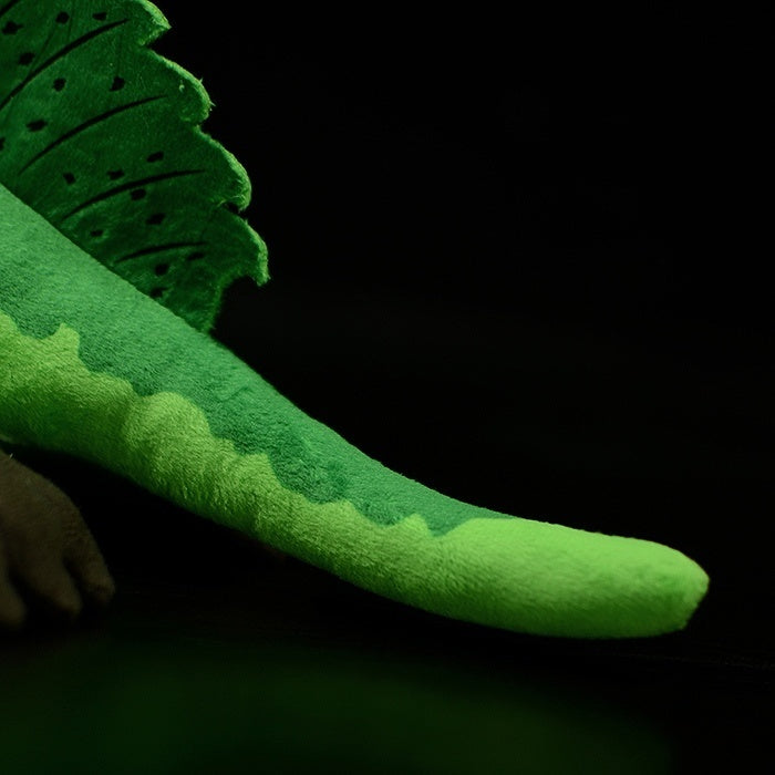 Spinosaurus plush tail featuring a long, smooth green texture with accurate Jurassic detailing