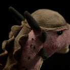 Detailed side perspective of the SoftDaysLab® Pachycephalosaurus Plush Toy, showing horn and neck accents
