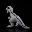 Side view of SoftDaysLab®’s Velociraptor plush with blue stripes, showcasing detailed tail and sleek posture