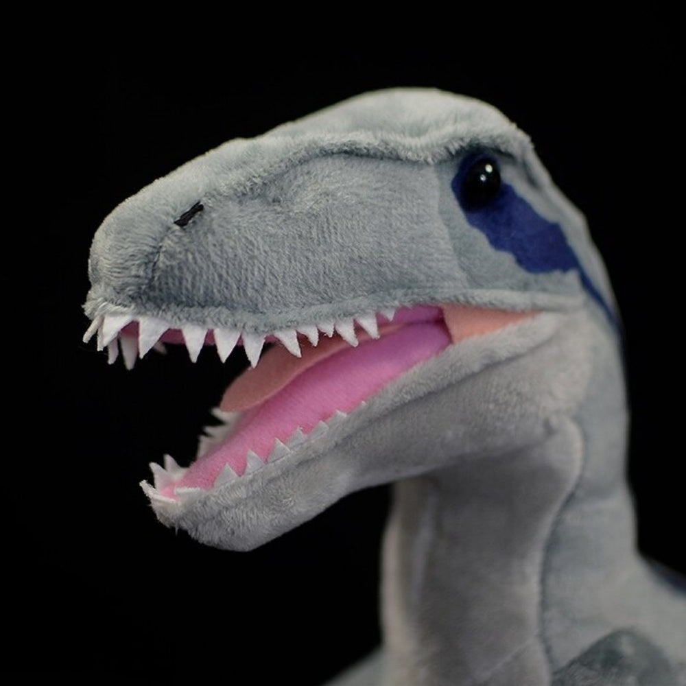 Front close-up of SoftDaysLab® Velociraptor plush with sharp teeth and blue-striped head for dinosaur fans