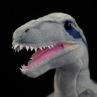 Front close-up of SoftDaysLab® Velociraptor plush with sharp teeth and blue-striped head for dinosaur fans
