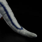 Tail detailing of the SoftDaysLab® Velociraptor plush, featuring iconic blue stripes in realistic design