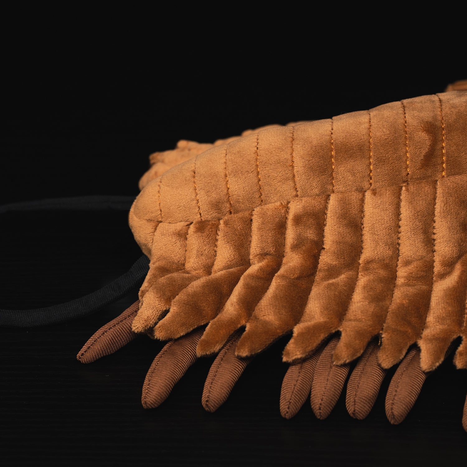 Close-up of segmented legs and body detail on the Redlichiida Trilobite Plush, perfect for prehistoric and fossil toy collectors