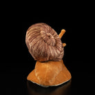 Back view of snail plush toy showcasing its spiral shell and smooth body by SoftDaysLab