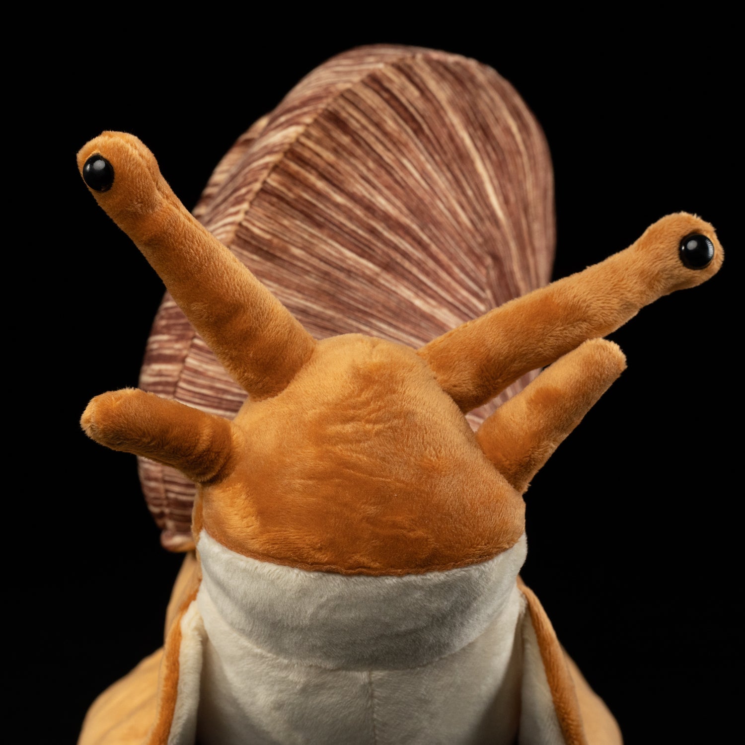 Close-up of snail plush toy’s face, featuring detailed antennae and soft fabric by SoftDaysLab